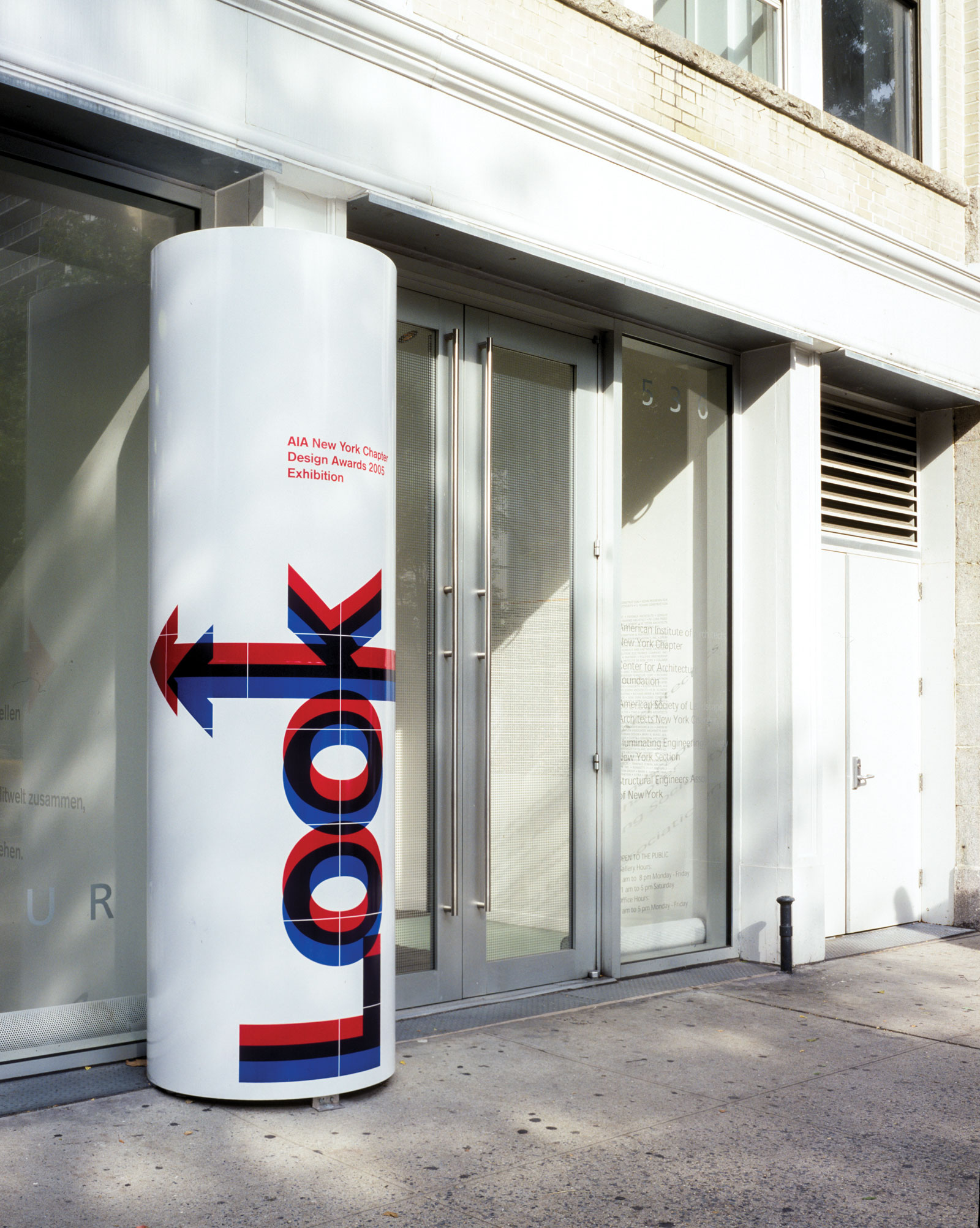 Exhibition design for American Institute of Architects New York. Exterior signage on cylindrical pillar.